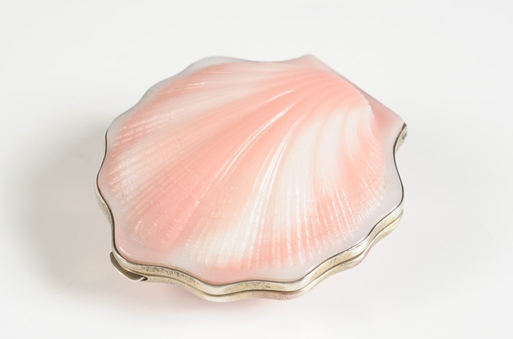 RUSSIAN .875 SILVER SEASHELL COMPACT: Pink and white seashell with .875 silver frame, mirrored lid, hinged powder well in the base, mesh sifter, marked on the base, measures 3.25 x 2.75 inches.