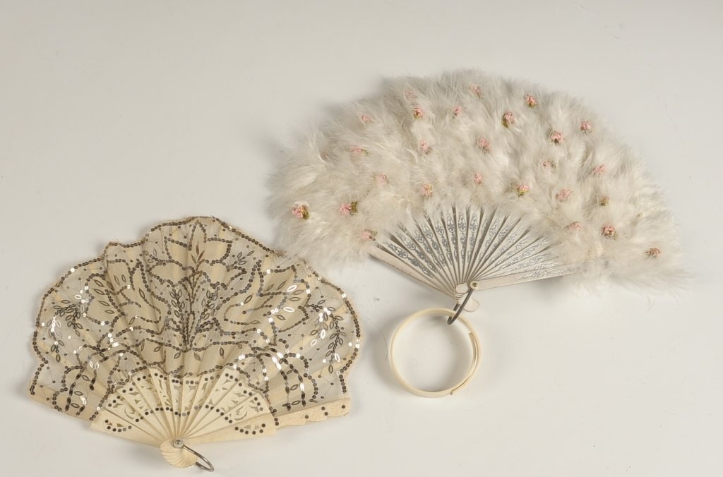 ANTIQUE CARVED BONE FAN & VINTAGE FEATHER FAN: Vintage feather fan with bracelet, measures 7 inches. And a vintage carved bone fan with lace and sequins, measures 6.5 inches.
