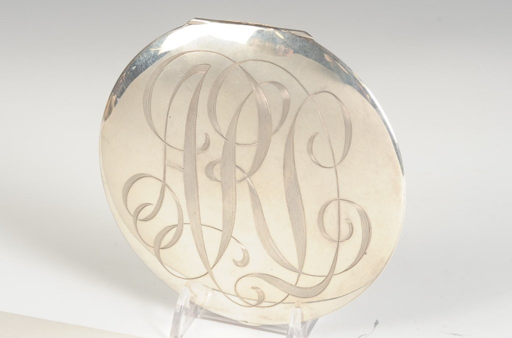 VERY LARGE STERLING COMPACT: Monogrammed on the top, mirror in the lid, mesh sifter and puff present, marked on the rim, measures 5 inches, weighs 8.35 ozt.