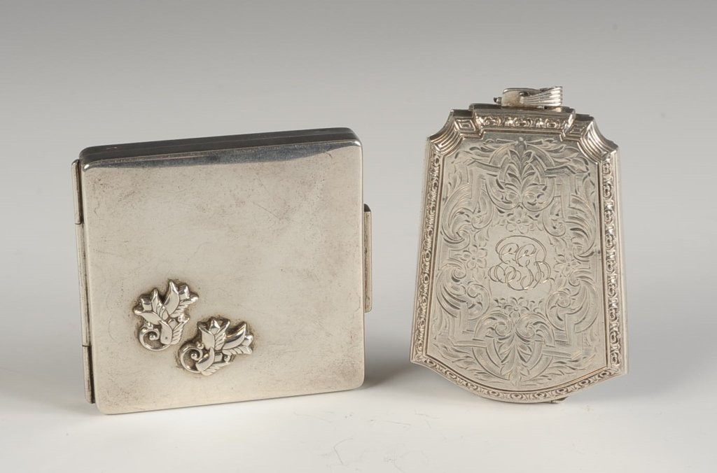STERLING COMPACT AND MINIAUDIÈRE: Compact with a beveled mirror in the lid, rotary sifter in the base, marked on the inside, monogram on the bottom, measures 2.5 x 2.5 inches, weighs 3.4 ozt., very good. Plus a chased sterling miniaud