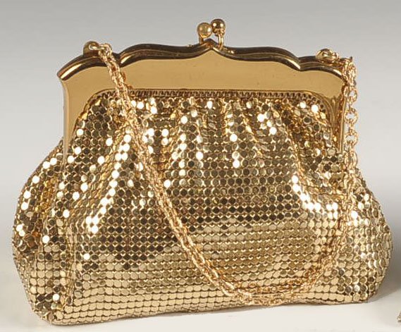 WHITING & DAVIS ARMOR MESH BAG WITH ORIGINAL BOX: Goldtone armor mesh bag with chain handle, goldtone frame, satin lining, marking on the bag frame and with a satin tag, with an original branded box, purse measures 4.5 x 5 inches with a 4 inch drop f