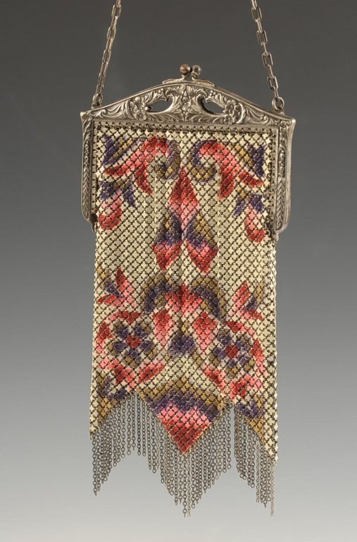 MANDALIAN MFG. CO. ENAMELED ARMOR MESH BAG: Silvertone frame, chain handle, enameled floral design, chain fringe, marked on the inside of the bag, measures 7.5 x 3.75 inches with a 5.5 inch drop from the handle.