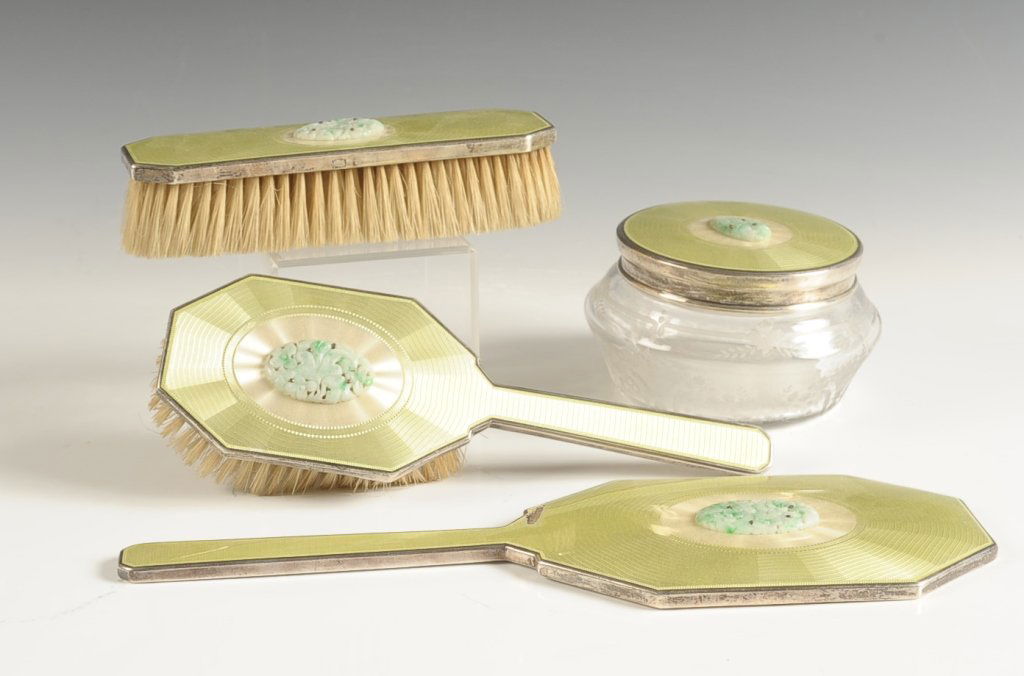PICARD STERLING & GUILLOCHE DRESSER SET WITH JADE: Sterling and green guilloche powder jar, hair brush, hand mirror and clothing brush all with carved jade medallions, measure from 5 to 12 inches.