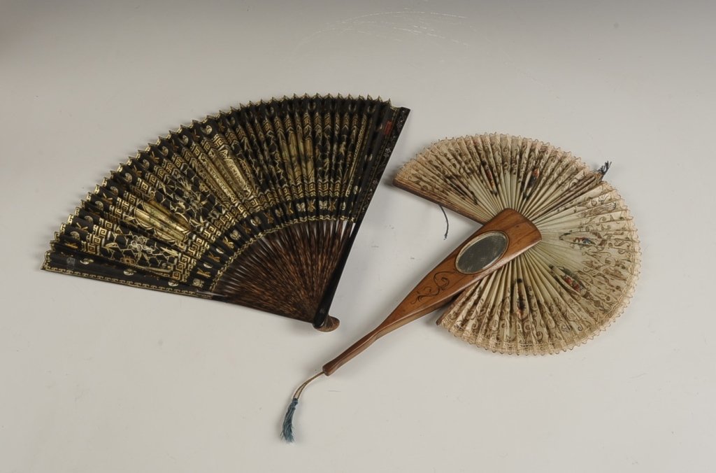 TWO VINTAGE PAPER FANS: Italian fan with wooden handle inscribed 'Ricardo' and with a mirror in the side, slide out paper fan, measures 14 x 10 unfolded, cords to move the fan in and out of the handle are tattered. Plus an A