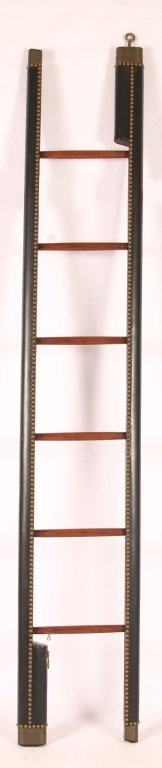 LEATHER COVERED BRASS STUDDED LIBRARY LADDER: A 20th century folding library ladder with sedways opening to six rungs.