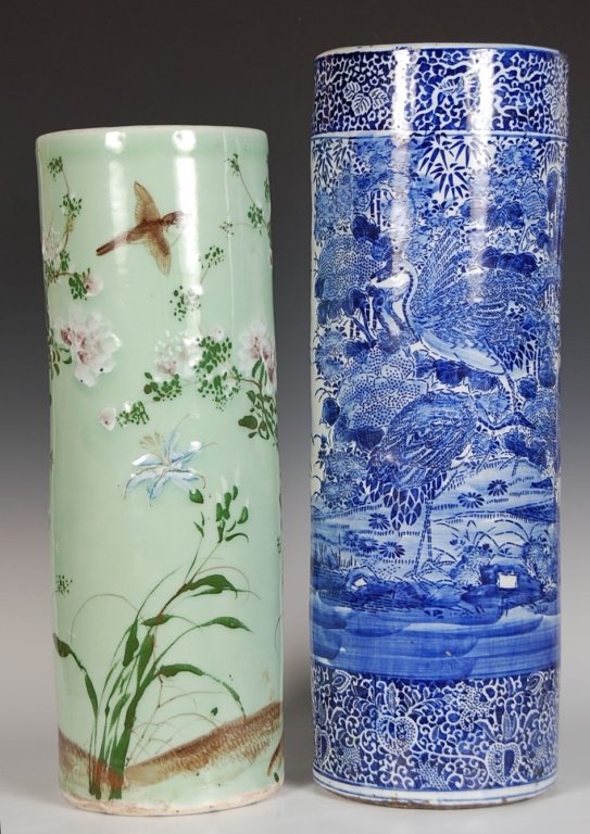TWO CHINESE FLOOR VASES OR UMBRELLA STANDS: Two Chinese cylindrical vases, one celadon-glazed with overglaze enamel designs of birds and flowers; the other decorated with a dense design of cranes with floral scroll borders in underglaze blue, e