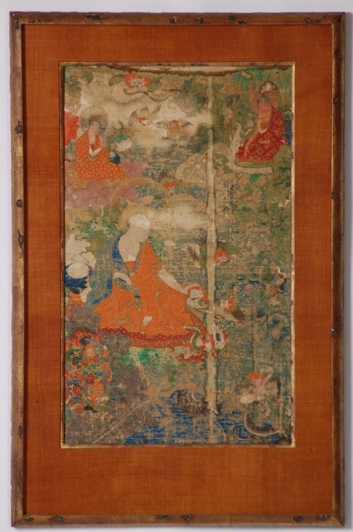 19TH CENTURY SINO-TIBETAN BUDDHIST THANGKA PAINTING: A Sino-Tibetan framed painting of a monk, surrounded by animals, the Buddha, and other Buddhist figures. Framed, formerly a scroll; distemper and gold pigment on cloth, circa 19th century. Including t