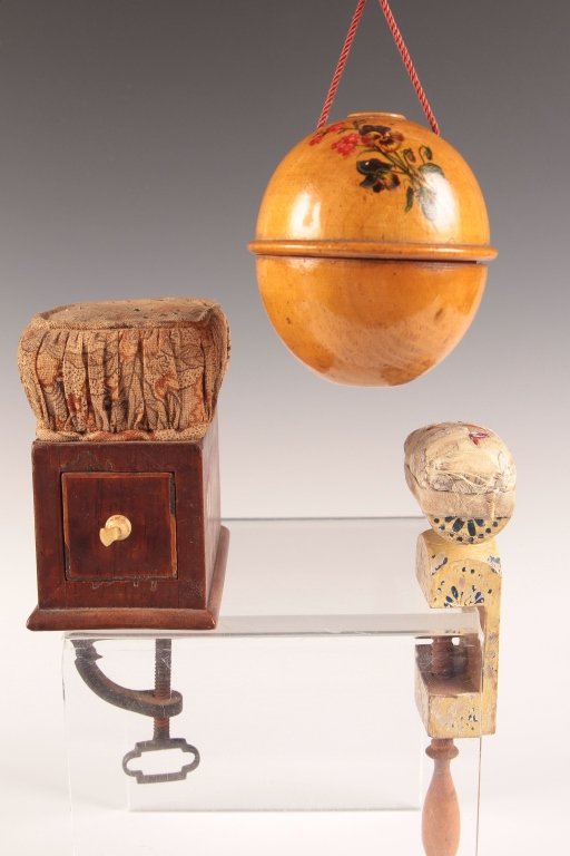 LOT OF ANTIQUE SEWING ITEMS: Including a nice clamp on sewing cushion with line inlay and marquetry initials, plus a fruit wood yarn holder, and a painted clamp on pin cushion with embroidered Asian cover. Three pieces ranging in