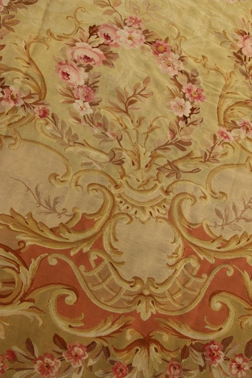 A LARGE 19TH CENTURY CIRCULAR DESIGN AUBUSSON RUG: Measures 15 ft. 9.5 inches x 16 ft. 11.5 inches.