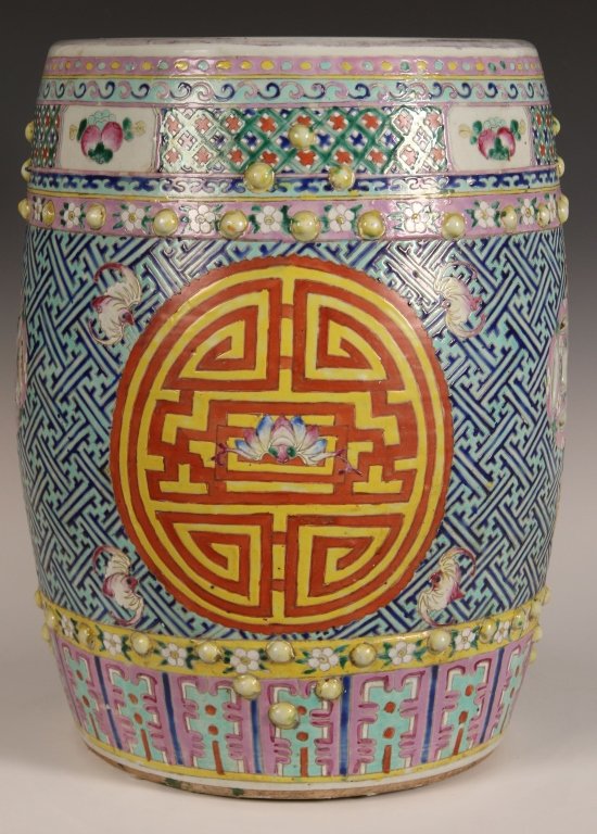 19TH / 20TH C. CHINESE GARDEN STOOL: Chinese, porcelain barrel-form garden stool with auspicious emblems including bats, pierced double-coins, and a central medallion featuring the character "shou," for longevity, in overglaze enamels su