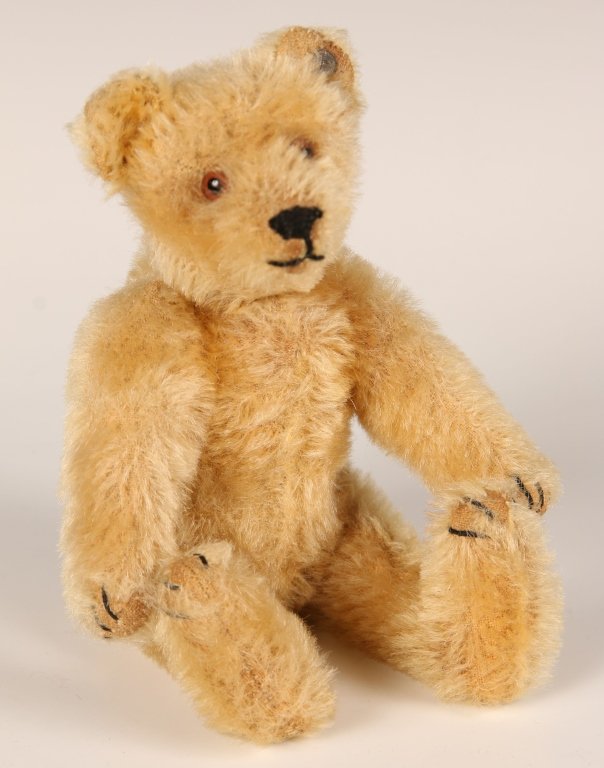 ANTIQUE STEIFF SIX INCH BEAR 5315,2: Glass eyes, horizontally stitched nose, light brown mohair, hump on the back, long arms and legs, all caps STEIFF button in ear, non-working growler present, excelsior stuffing, no label, measures 6 i