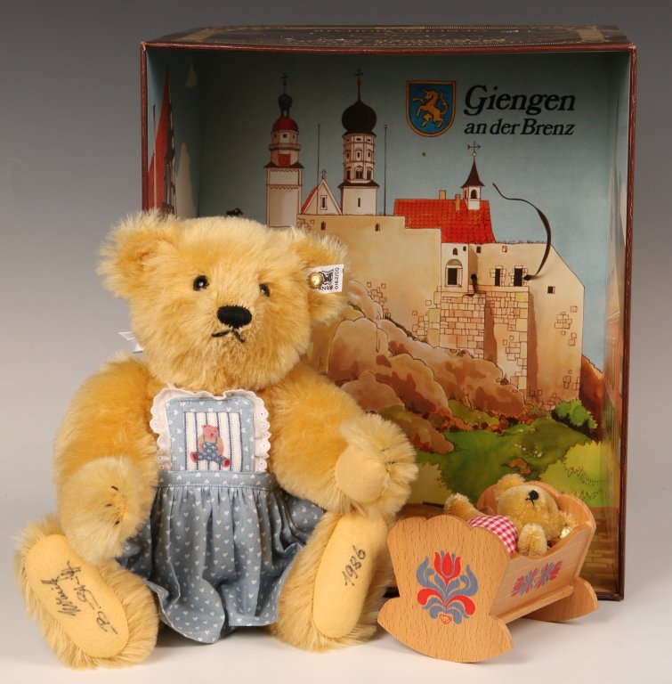 STEIFF GIENGEN CRADLE LIMITED EDITION SET, SIGNED: Mother bear with baby in cradle, 0162/00, signed on the paw pads by Hans Otto Steiff and Birgit Steiff and dated 1986, buttons in ears and white label in the mother's ear, paper chest tag, with origin