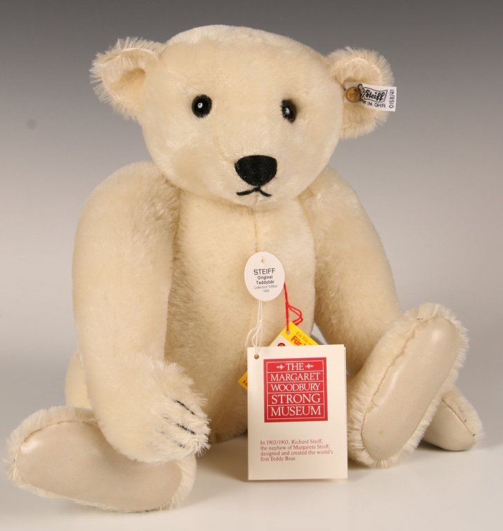 STEIFF MARGARET STRONG WHITE BEAR W LEATHER PAWS: 1985, limited edition of 2000, white mohair with leather paw pads, button in ear with white label, paper chest and hang tags, measures 16 inches (41 cm).