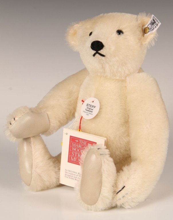 STEIFF MARGARET STRONG WHITE BEAR W LEATHER PAWS: 1985, limited edition of 2500, 0158/31, white mohair with leather paw pads, button in ear with white label, paper chest and hang tags, measures 12 inches (31 cm).