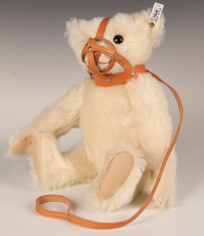 STEIFF REPLICA MUZZLE BEAR LIMITED EDITION W BOX: 1990 replica of the 1908 edition, white mohair with a leather muzzle collar, growler, button in ear with white label, 406126, limited edition of 6000, measures 14 inches (35 cm) standing.