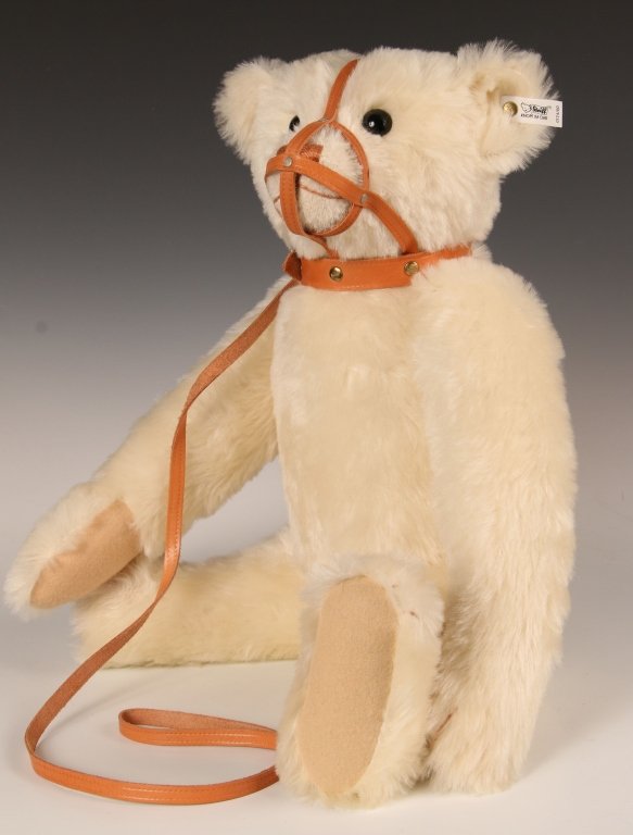 STEIFF REPLICA MUZZLE BEAR LIMITED EDITION W BOX: 1989 replica of the 1908 edition, white mohair with a leather muzzle collar, growler, button in ear with white label, 0174/60, limited edition of 2650, measures 23 inches (58 cm) standing.