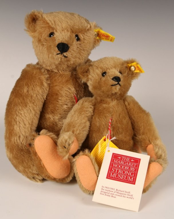 TWO STEIFF MARGARET STRONG TEDDY BEARS: 0155/26 and 32, buttons in ears with yellow tags, smaller bear with paper hang tags, measure 10 and 12 inches (26 and 32 cm).
