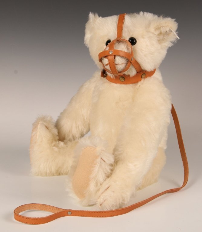 STEIFF REPLICA MUZZLE BEAR LIMITED EDITION W BOX: 1988 replica of the 1908 edition, white mohair with a leather muzzle collar, growler, button in ear with white label, 0174/46, limited edition of 5000, measures 18 inches (46 cm) standing.