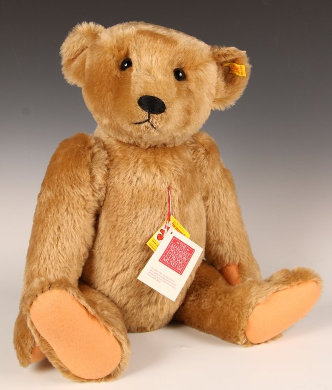 STEIFF MARGARET STRONG GOLD BEAR: Circa 1984, button in ear with yellow label, paper hang tags, measures 23 inches (60 cm).