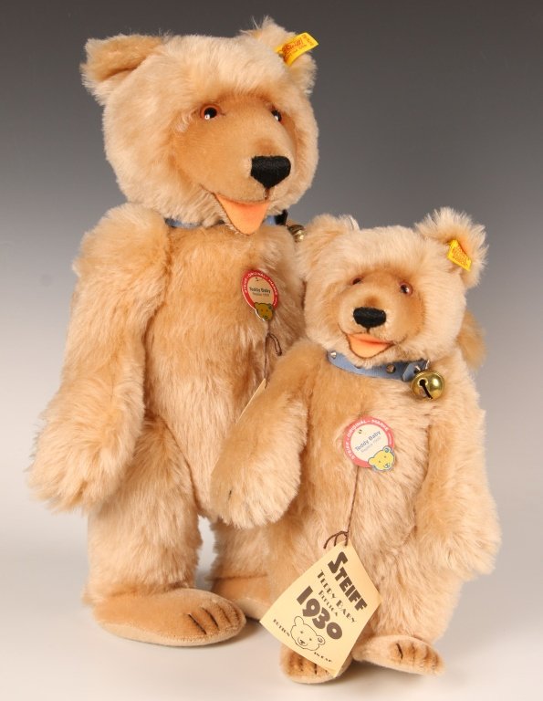 TWO STEIFF TEDDY BABY REPLICA BEARS, ONE SIGNED: 1984 replicas of the 1930 editions, 0176/29 and 42, button in ear with yellow label, paper chest tags and hang tags, 16 inch bear is signed on the paw pads by Hans Otto Steiff and Birgit Steiff and da