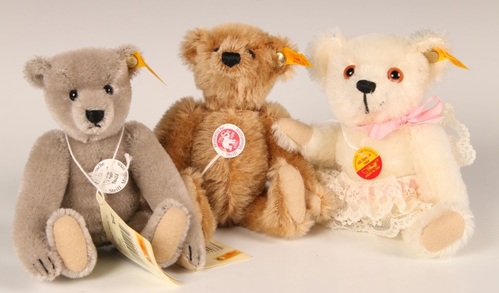 THREE SMALL STEIFF BEARS: 029073, 029288 and 029172, buttons in ears, yellow labels, paper chest and hang tags, measure 6 inches each standing.