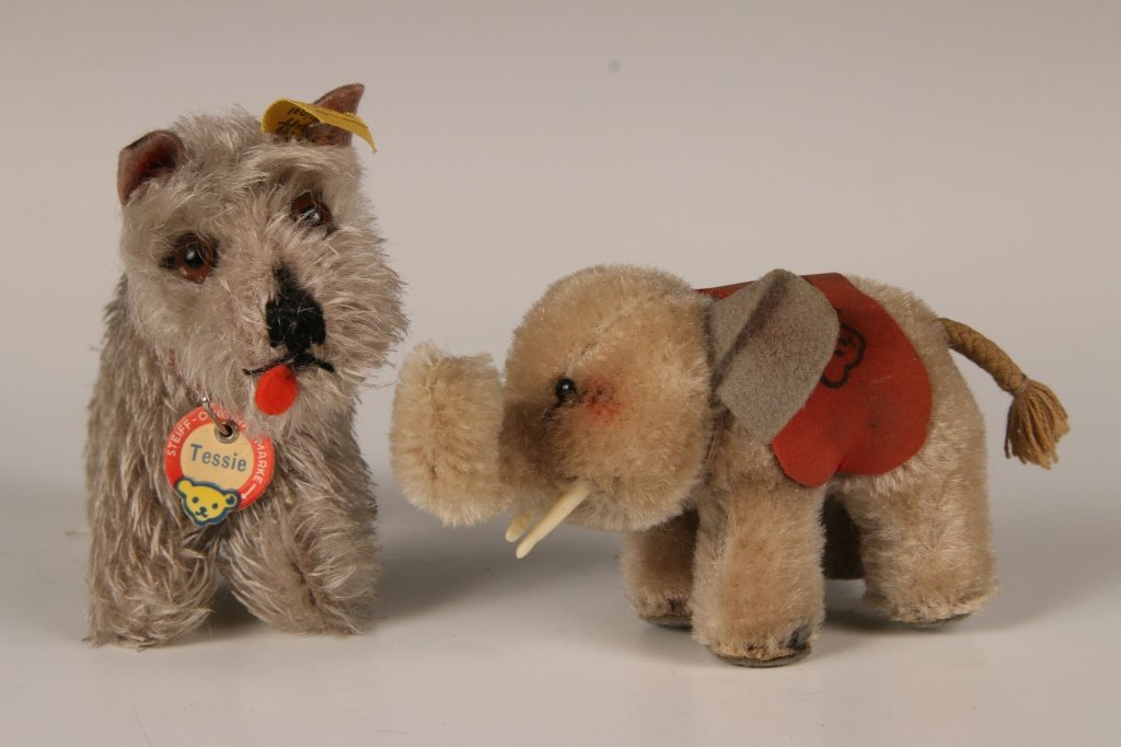 1960s STEIFF TESSIE SCHNAUZER & ELEPHANT: Vintage 1314,00 Tessie the Schnauzer dog, leather color, glass eyes, felt ears and tongue, button in ear with yellow label, paper chest tag, measures 4 inches standing. Plus mini Steiff elephant 6307,