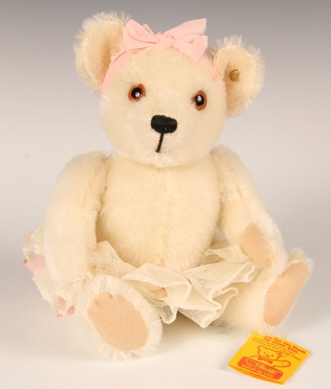 STEIFF BABY OPHELIA TEDDY BEAR WITH TUTU: 0225/27, button in ear and white label on the leg, paper hang tag, measures 10 inches (27 cm).