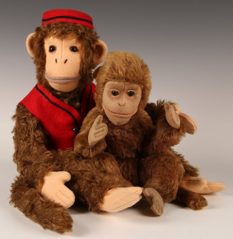 TWO ARTISAN STUFFED MONKEYS: Organ grinder monkey by Craig Bottiger of Cedar Creek Cubs, measures 20 inches from hat to tail, very good. Plus an unmarked stuffed monkey, measures 8 inches while sitting, some possible fur loss on