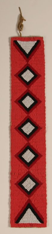 A CONTEMPORARY CROW BEADED BELT: With Gingham floral backing. Measures 5 x 27 inches.