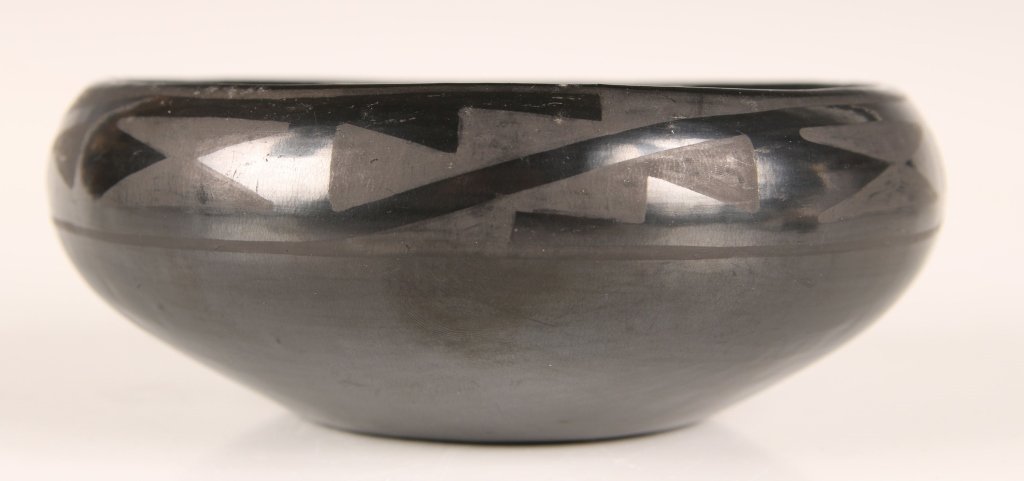 SAN ILDEFONSO POTTERY BOWL SIGNED 'MARIE': Polished black with geometric designs. Signed on the base. Measures 2 x 5 inches.