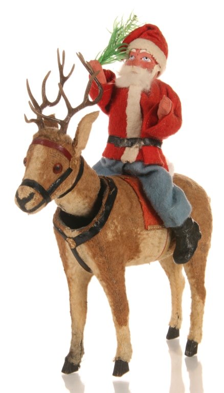 C. 1900 GERMAN SANTA CLAUS RIDING NODDER REINDEER: A fine papier mache Santa on plush 'fur' covered reindeer with nodder head that moves up and down. Measures 10.5 x 8 x 4 inches.