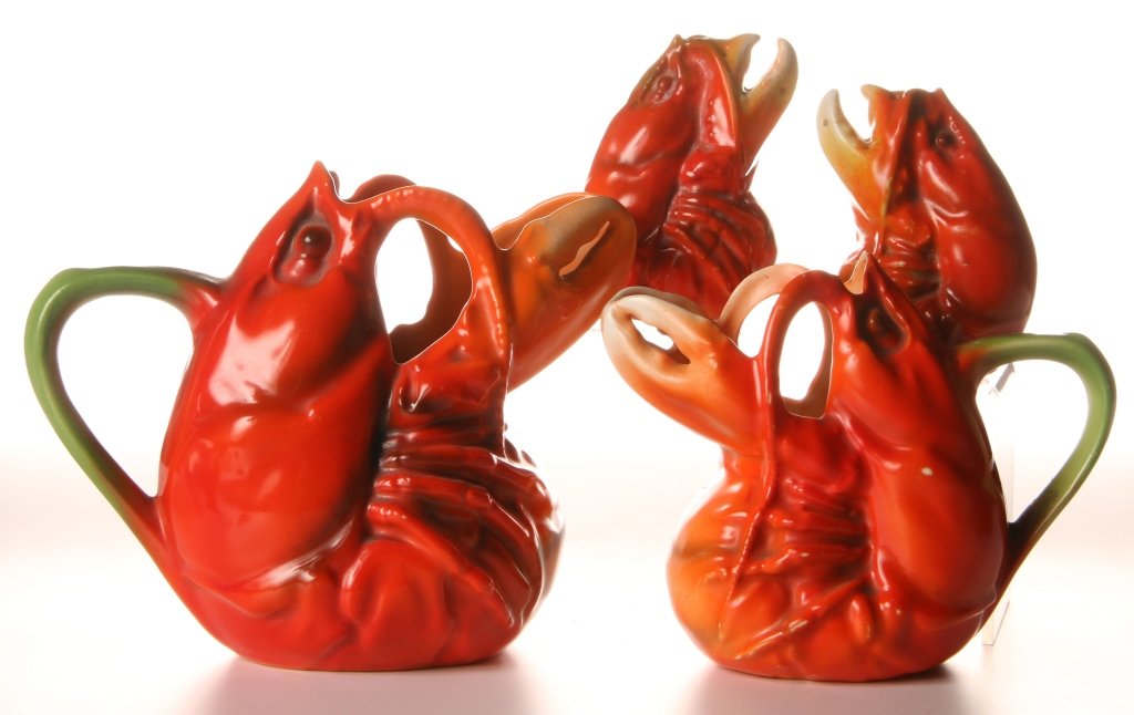 4 PIECES ROYAL BAYREUTH FIGURAL LOBSTER TABLEWARE: Milk pitcher marked with a green #12 ink stamp measures 5 inches; creamer with a blue #15 ink stamp measures 4 inches; and a pair of salt and pepper shakers marked Germany in blue, measure 3 inches.
