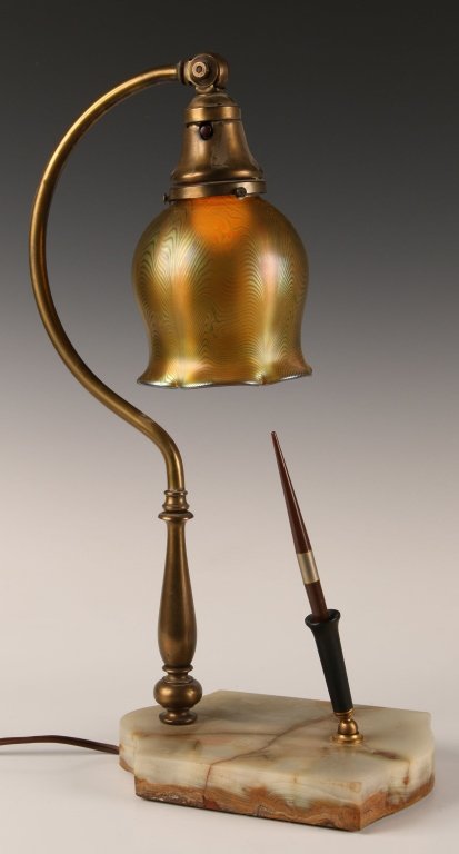 1920S ONYX BASE LAMP WITH ART GLASS AND PEN STAND: An unusual table lamp with pulled feather iridescent shade (unsigned) and Bakelite pen holder. Measures 18 x 6 x 8 inches, including a shade that measures 5 x 4.25 inches.