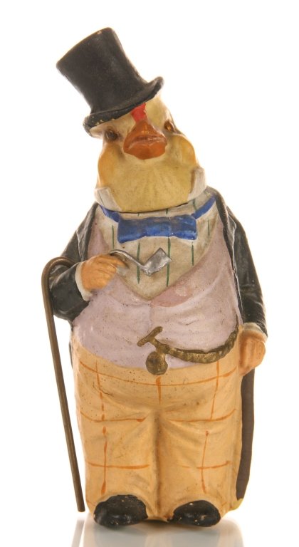 DAPPER CANARY ANTIQUE GERMAN CANDY CONTAINER: Papier mache German candy container circa 1900, a canary bird dressed as a rotund gentleman. Very nice features and detail, all original. Measures 6 x 2.75 x 2.5 inches.