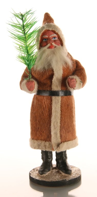 CIRCA 1900 GERMAN PAPIER MACHE CANDY CONTAINER: Classic figure with painted papier mache details and white real fur beard. Opens at the waist to access the candy. Measures 8 x 3 inches.