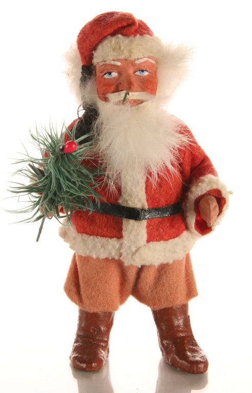 C. 1900 GERMAN PAPIER MACHE SANTA CLAUS CANDY CONTAINER: White hair beard, red papier mache face and hands. Opens at the waist to access the candy. Measures 6 x 3.5 inches.