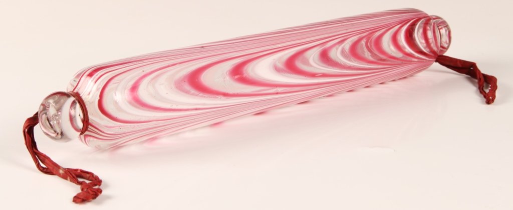 19TH CENTURY NAILSEA BLOWN GLASS ROLLING PIN: Approximately 13 inches, looping Nailsea type glass.