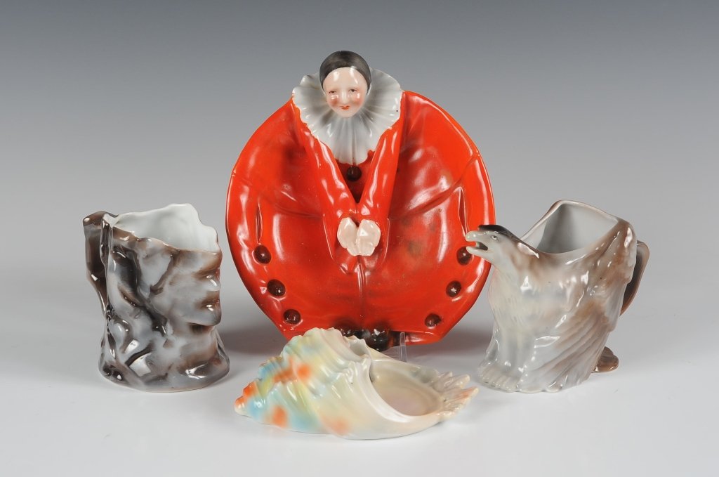 ROYAL BAYREUTH CANDY DISH, CREAMERS & WALL POCKET: Red clown candy dish marked with a blue #9 inkstamp, measures 2.25 x 7 inches, some soiling, fingers have a flake on the tips. Eagle creamer, blue #15 inkstamp, measures 4 inches, good. Seashell wall 