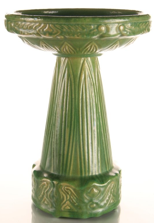 MID-WESTERN MINIATURE STONEWARE BIRD BATH: Salesman's sample sized stoneware bird bath in green glaze. Two pieces, with one under plate measuring 1.75 x 6.5 inches in diameter, and the other piece measures 7.25 x 4.25 inches.