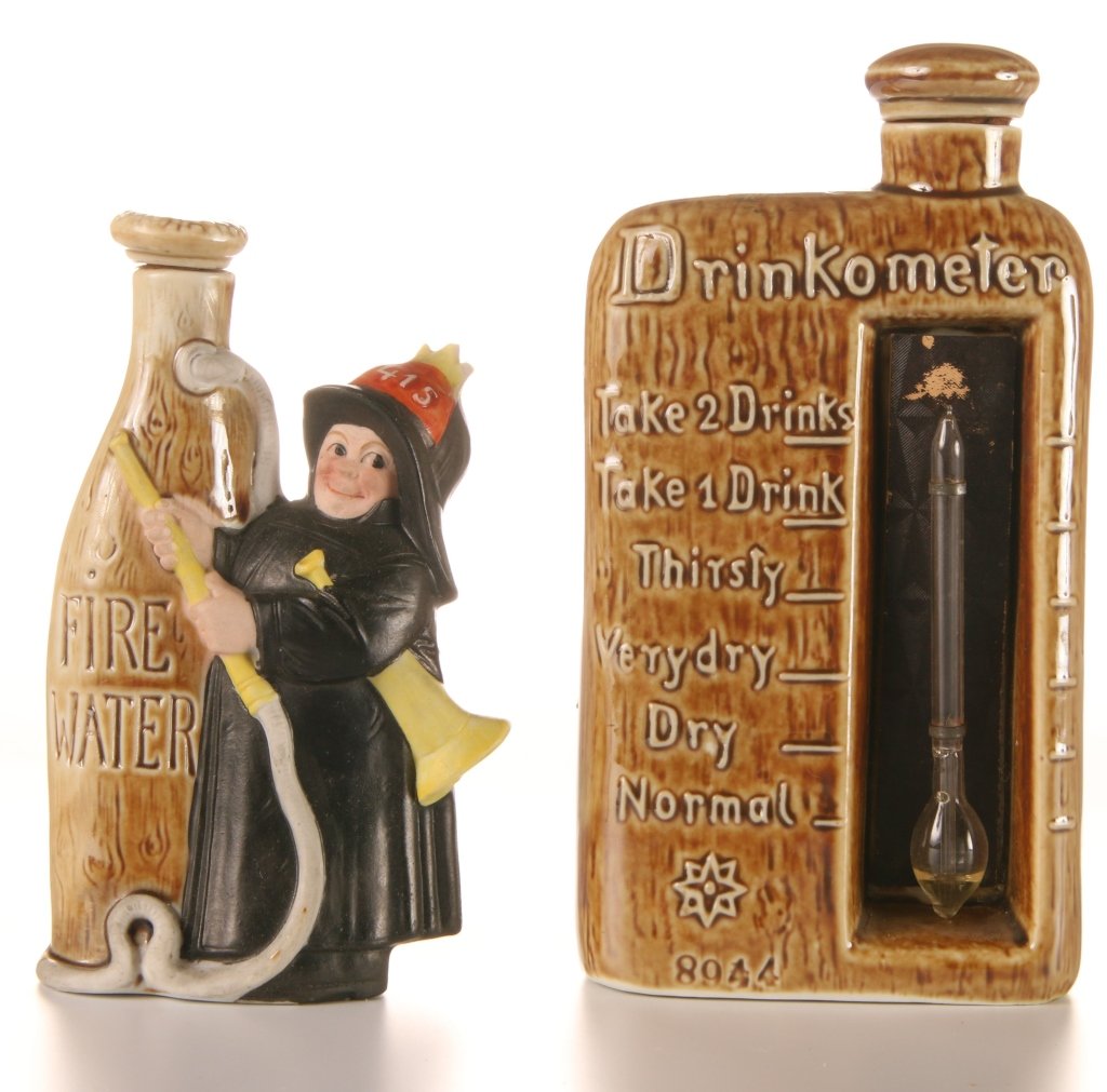 SCHAFER & VATER 'DRINKOMETER' & 'FIRE WATER' TIPPLERS: Polychrome glazes, impressed mark on the Fire Water, measures 4.75 and 5.75 inches.