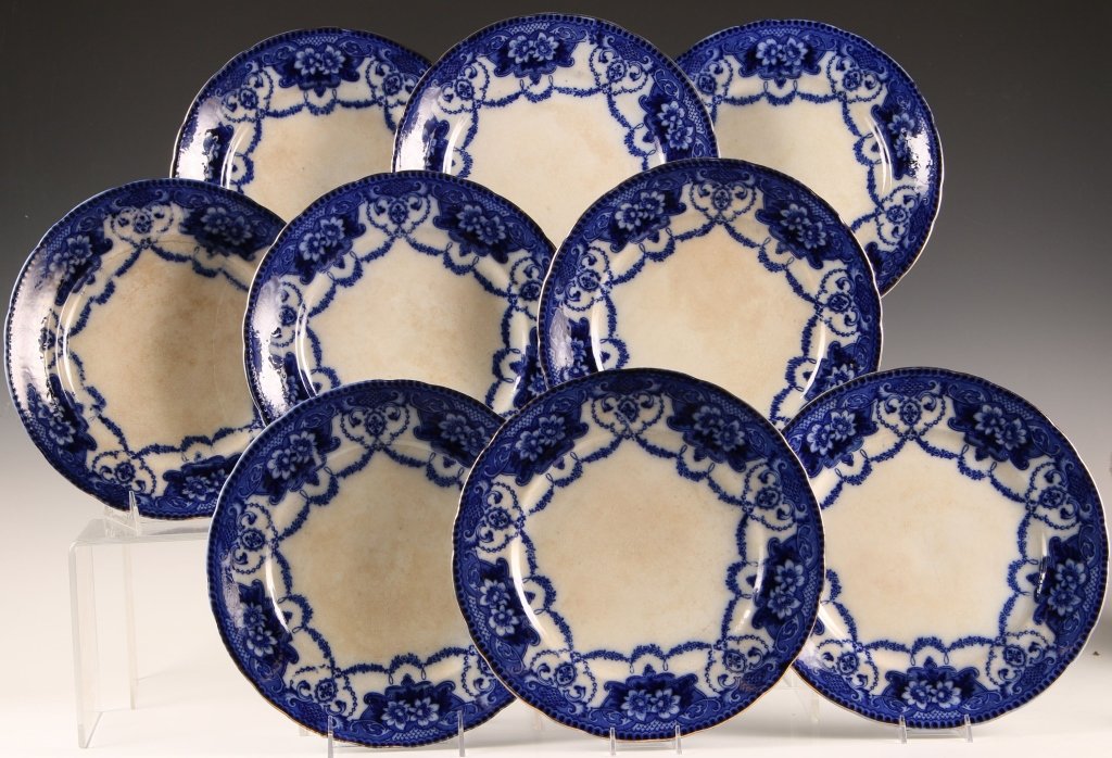 NINE FLOW BLUE DINNER PLATES: Set of nine plates each measuring 10.5 inches in diameter.
