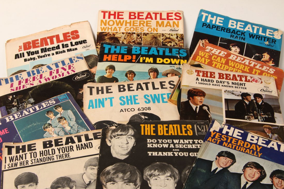 COLLECTION OF EARLY BEATLES 45 RECORDS WITH SLEEVES: Plus other hit singles from the 60s and 70s, 64 records total.