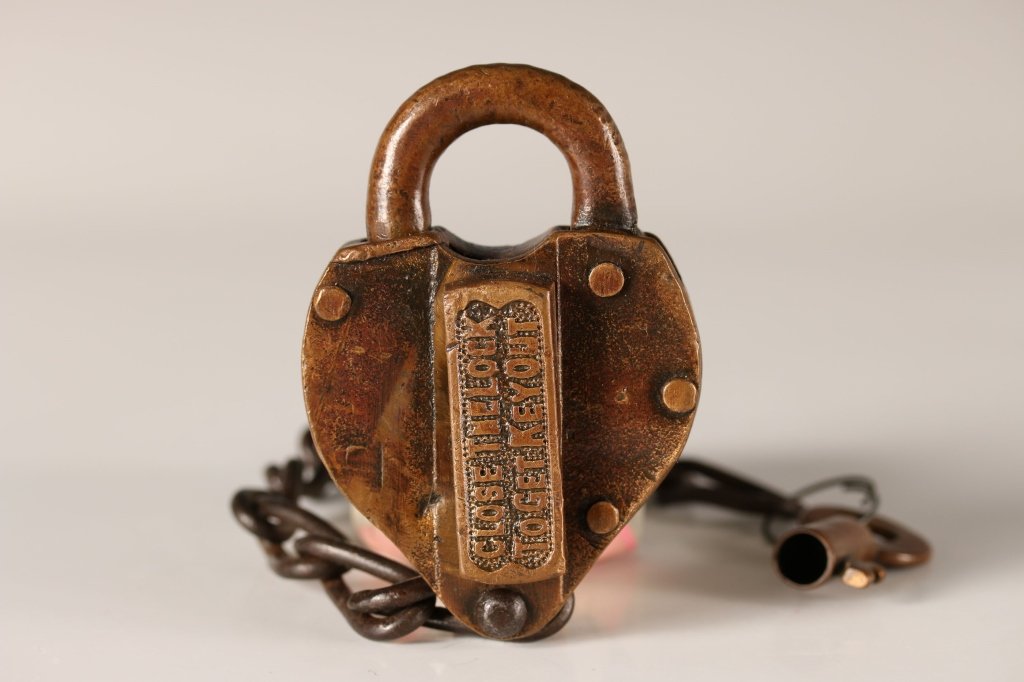 MISSOURI KANSAS TEXAS MK&T RAILROAD PADLOCK AND KEY: Raised lettering 'M.K. & T. Ry.' Swivel lock cover with 'Close the lock to get key out'. With chain and unattached key marked 'MK&T RY.' 3.75 x 2.5 inches. Good condition.