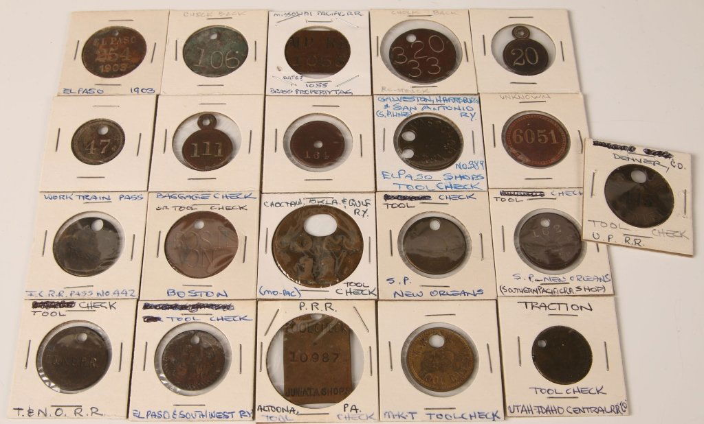 TWENTY ONE RAILROAD TOOL CHECK AND RELATED TAGS: Each in coin holder and identified to exterior where possible. Includes El Paso & Southwest Ry, MK&T, Mo Pac, Traction, Galveston, Harrisburg & San Antonio, Work Train and more. Good condition overall