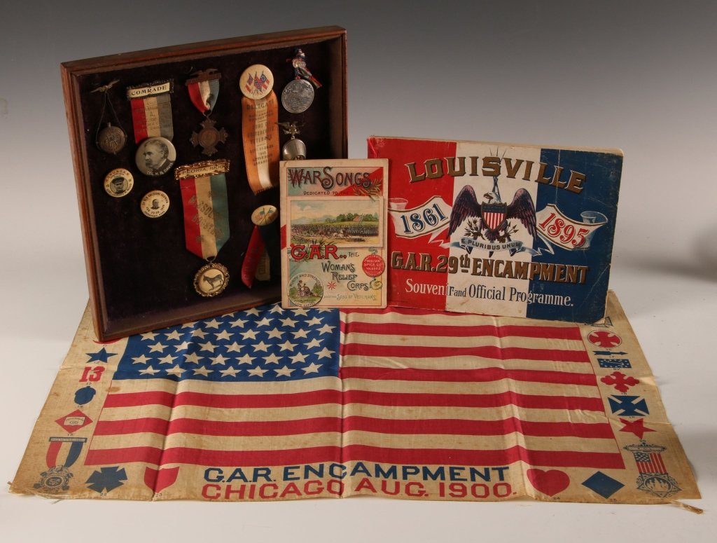 COLLECTION OF G.A.R. & CIVIL WAR VETERANS REUNION ITEMS: Including buttons, medals, booklets and a printed flag from Chicago Encampment. Group ranging in size from a booklet measuring 7.75 x 11 inches, to an individual badge measuring 2.5 x 1.25 inches.