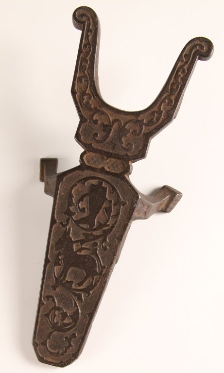 UNUSUAL EARLY CAST IRON BOOT JACK: Measures 2.75 x 10.75 x 4.75 inches.