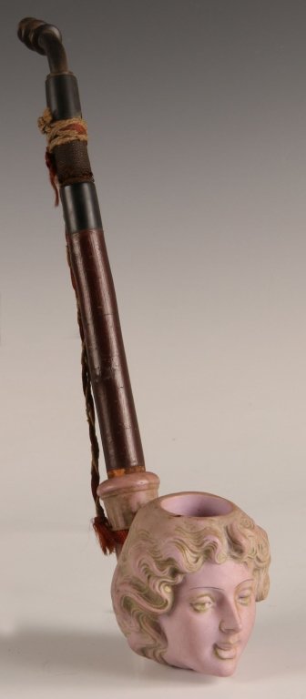 SCHAFFER AND VATER ART NOUVEAU LADY HEAD SMOKING PIPE: Unmarked, lavender bisque porcelain bowl in the form of a ladies head. Measures 12.5 x 3.5 inches.