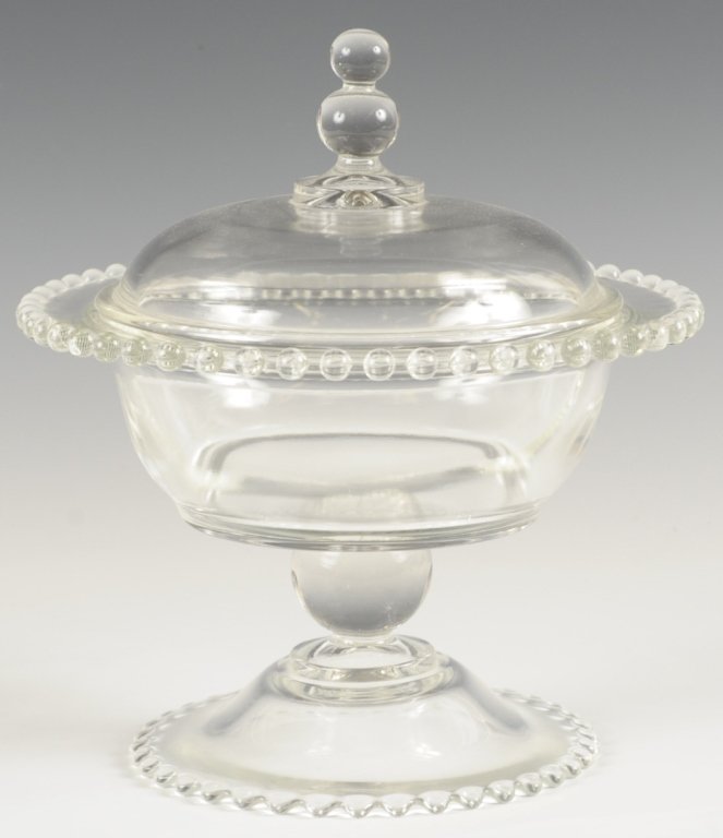 VERY RARE IMPERIAL CANDLEWICK BEADED FOOT CANDY JAR: Lidded candy jar with beaded foot, upper rim and finial, divided interior, 400/140, 1941-1943 only, measures 9 x 8.5 inches.