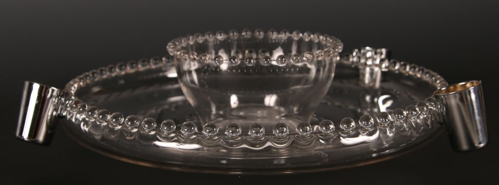 IMPERIAL CANDLEWICK HOSTESS HELPER SET: Circa 1959-1963, five piece set with glass bowl and large underplate, three silver side cups attach to the underplate, 400/244, measures 4 x 12 inches in diameter altogether.