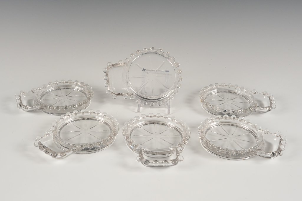 SIX IMPERIAL CANDLEWICK COASTERS WITH SPOON RESTS: 400/226, set of six matching pieces each measuring 4.75 x 3.75 inches.